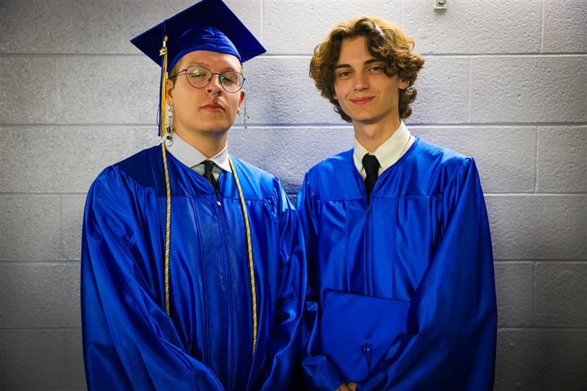 A group of graduates wearing blue robes